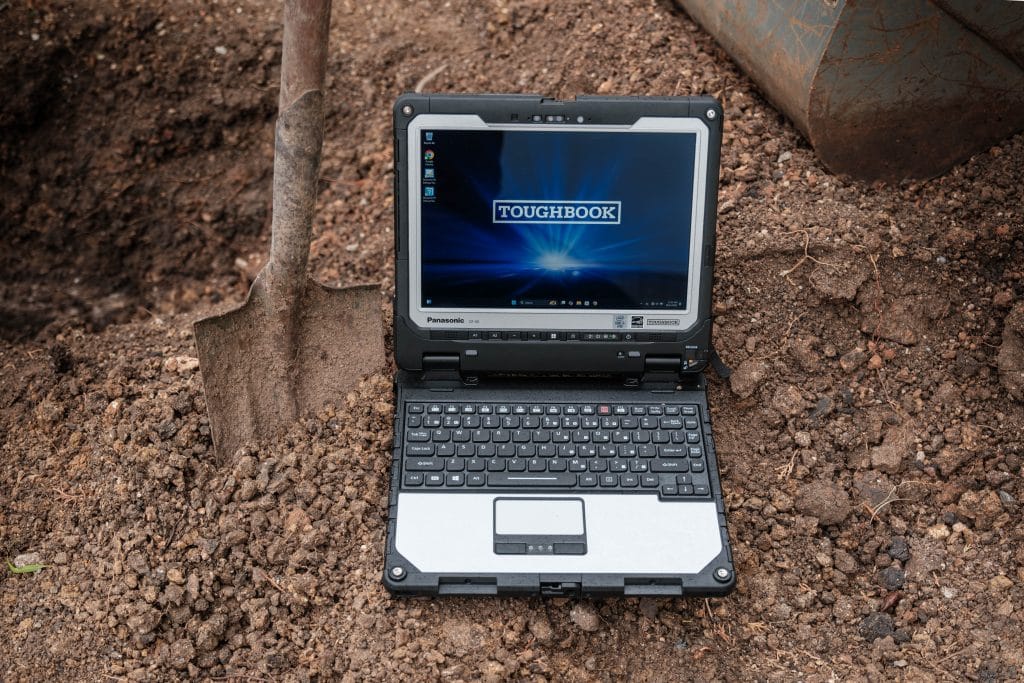 Panasonic Toughbook CF-33 MK2 on a job site with a shovel in the background.